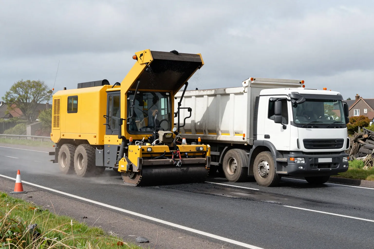 A cold milling machine discharging road planings into a tipper body